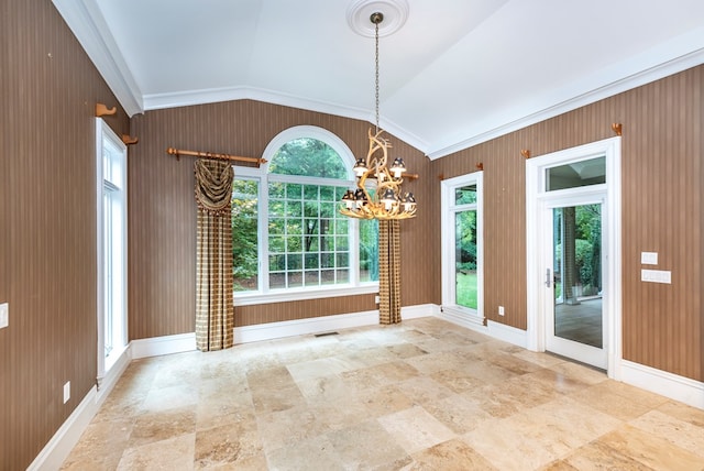 unfurnished dining area featuring crown molding, lofted ceiling, and a notable chandelier