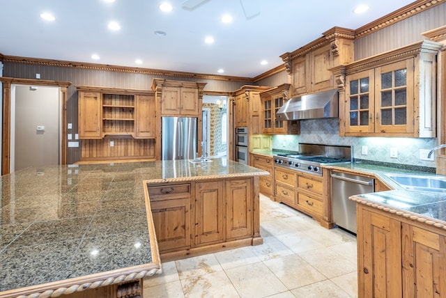 kitchen featuring sink, stainless steel appliances, tasteful backsplash, ventilation hood, and ornamental molding