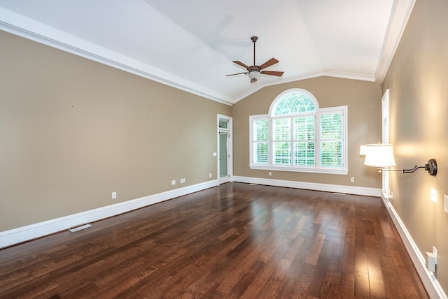 spare room with ceiling fan, dark hardwood / wood-style flooring, ornamental molding, and vaulted ceiling