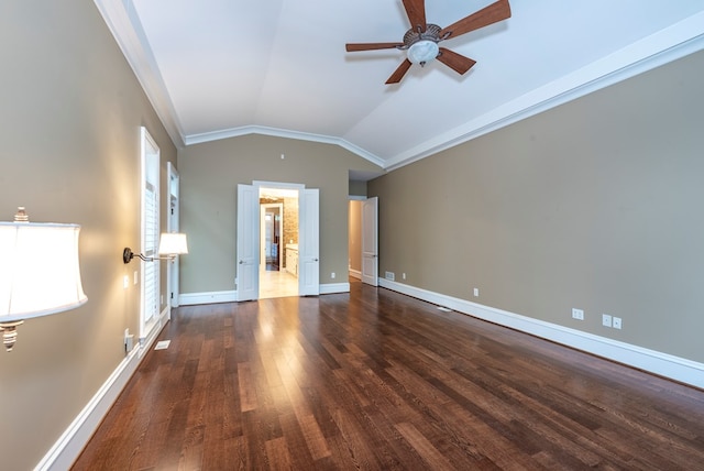 unfurnished living room with ornamental molding, vaulted ceiling, ceiling fan, and dark wood-type flooring