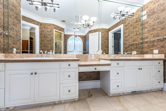 bathroom featuring vanity, crown molding, and a notable chandelier