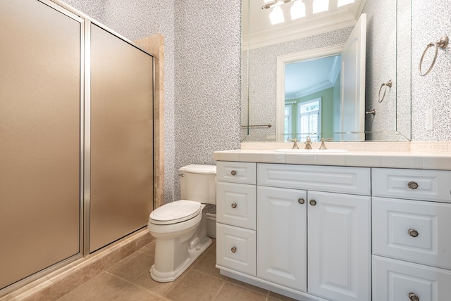 bathroom featuring tile patterned floors, crown molding, an enclosed shower, toilet, and vanity