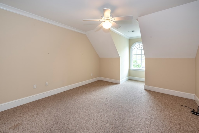 additional living space with carpet flooring, ceiling fan, and vaulted ceiling