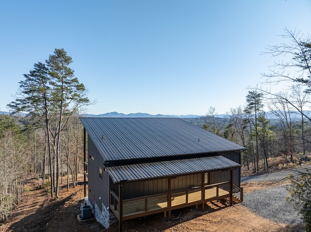 538 Mountain Laurel Rdg, Mineral Bluff, GA 30559 - view of side of property with central AC unit, metal roof, board and batten siding, and a mountain view