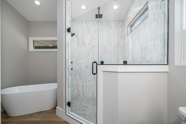 538 Mountain Laurel Rdg, Mineral Bluff, GA 30559 - bathroom featuring wood finished floors, a freestanding tub, a stall shower, recessed lighting, and toilet