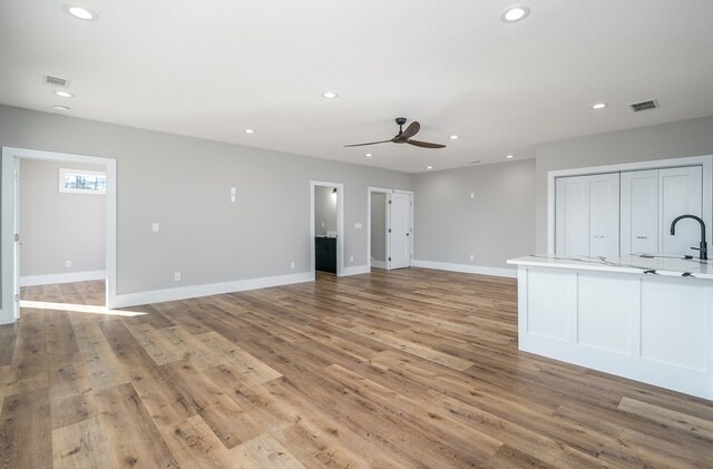 538 Mountain Laurel Rdg, Mineral Bluff, GA 30559 - unfurnished living room featuring a sink, ceiling fan, recessed lighting, light wood-type flooring, and baseboards