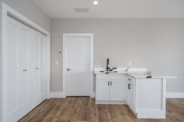 538 Mountain Laurel Rdg, Mineral Bluff, GA 30559 - bar area featuring a sink, light wood-style floors, recessed lighting, and baseboards