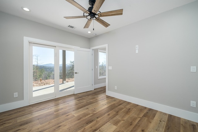 538 Mountain Laurel Rdg, Mineral Bluff, GA 30559 - empty room with wood finished floors, recessed lighting, a ceiling fan, baseboards, and a mountain view