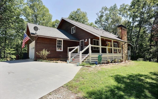 view of front of home featuring a garage and a front lawn