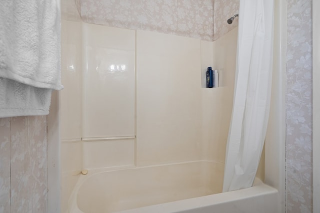 bathroom with shower / bathtub combination with curtain