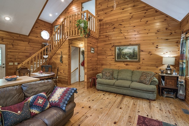 45 8 Point Trl, Blairsville, GA 30512 - living room featuring stairs, high vaulted ceiling, wood walls, and wood-type flooring