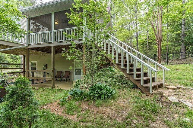 45 8 Point Trl, Blairsville, GA 30512 - back of property with fence, stairs, a patio, and a sunroom