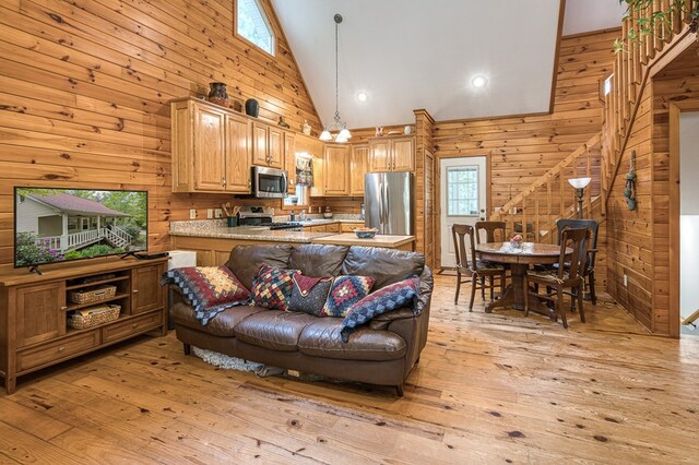 45 8 Point Trl, Blairsville, GA 30512 - living room featuring high vaulted ceiling, wood walls, and light wood-type flooring