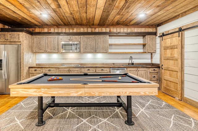 playroom featuring a sink, billiards, wooden walls, and wooden ceiling