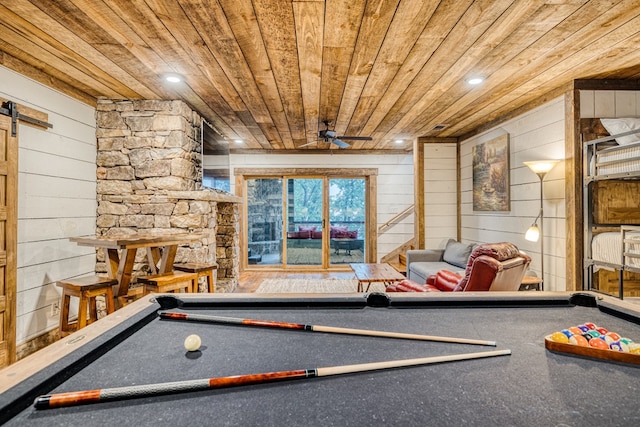 rec room with wooden walls, pool table, and wooden ceiling