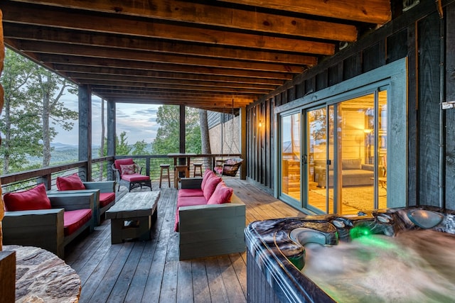 wooden deck with an outdoor living space