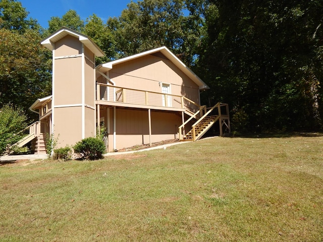 view of home's exterior featuring a wooden deck and a yard