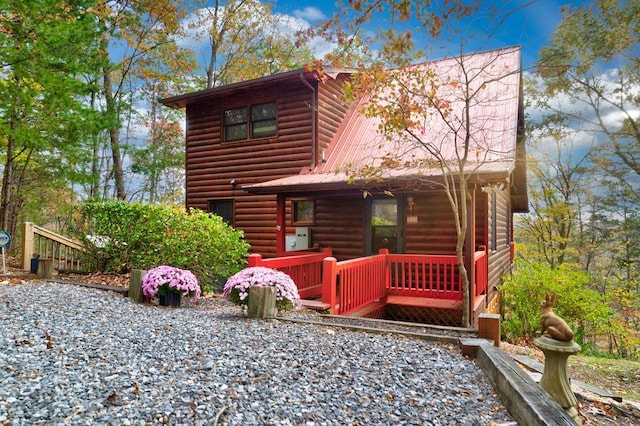 cabin with metal roof and faux log siding