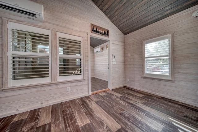 spare room with vaulted ceiling, wooden ceiling, a wall unit AC, hardwood / wood-style flooring, and wooden walls