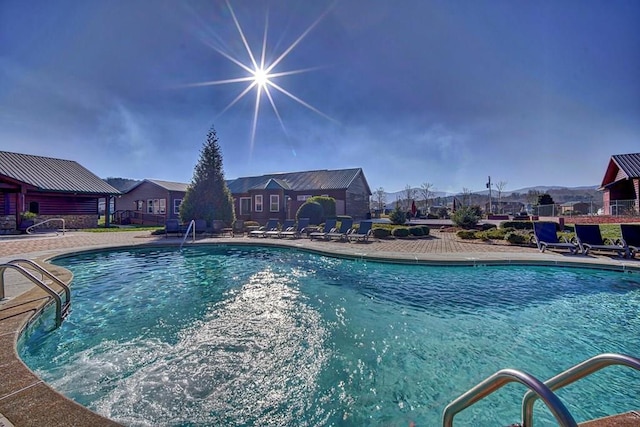 view of swimming pool with a patio area