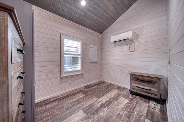 spare room with wood-type flooring, lofted ceiling, wood ceiling, and an AC wall unit