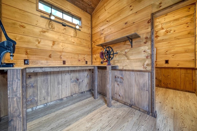 interior space featuring light hardwood / wood-style flooring and wooden walls