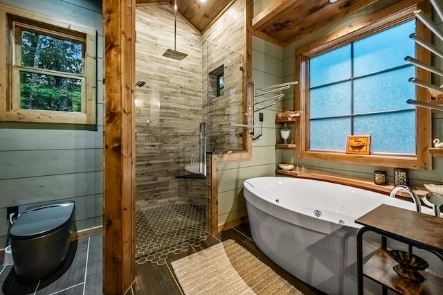 bathroom featuring wood walls, shower with separate bathtub, and vaulted ceiling