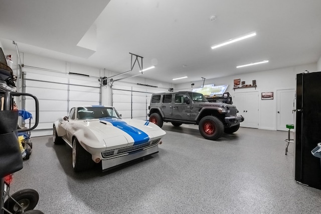 garage with black fridge