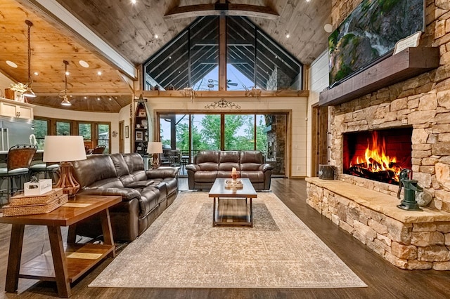 living room with beam ceiling, high vaulted ceiling, dark hardwood / wood-style floors, a fireplace, and wood ceiling