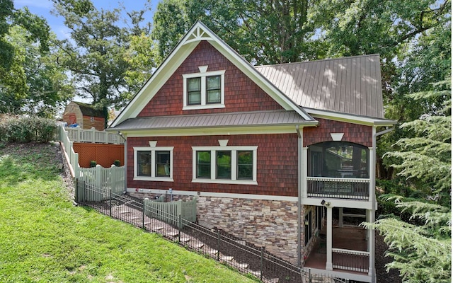 view of property exterior featuring a lawn