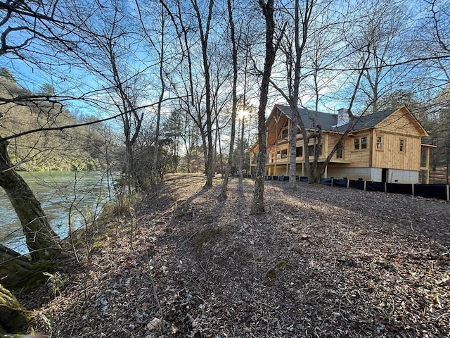 view of side of home with a chimney