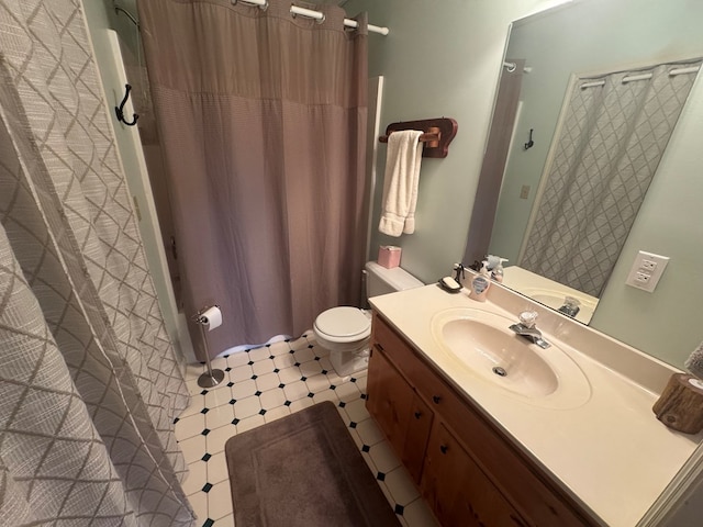 full bathroom with vanity, toilet, and tile patterned floors