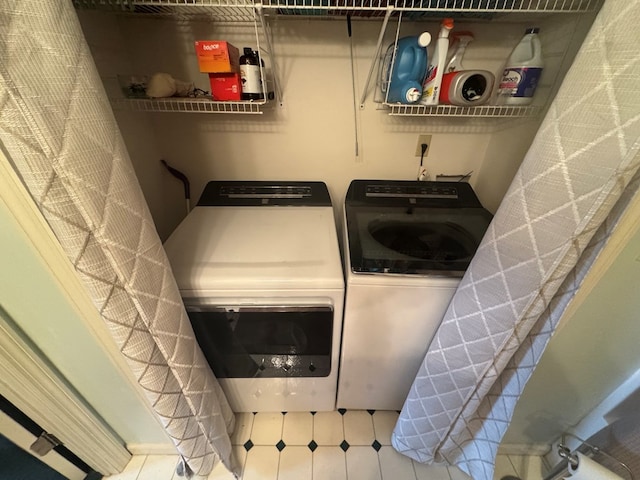 clothes washing area featuring laundry area and independent washer and dryer