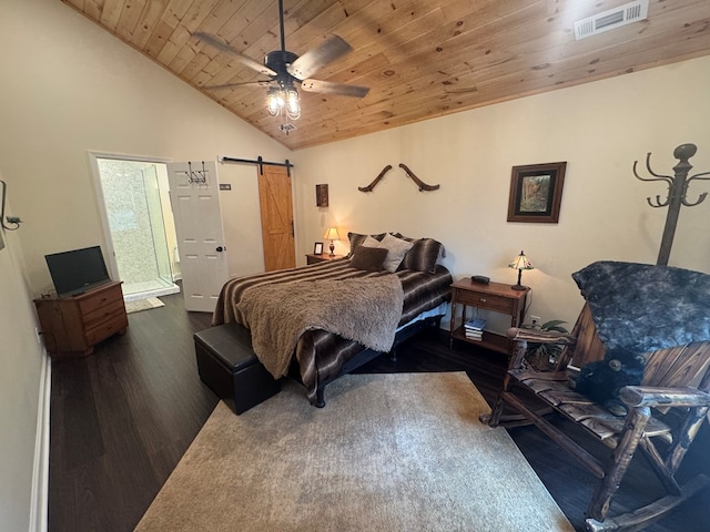 bedroom featuring visible vents, a barn door, wood ceiling, vaulted ceiling, and wood finished floors