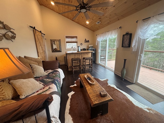 living room with a ceiling fan, wood ceiling, dark wood-style flooring, and a barn door