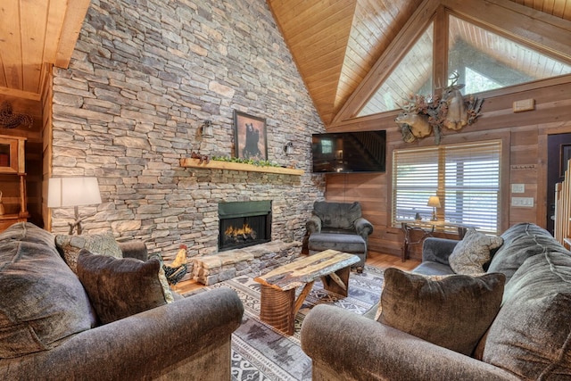 602 Mill Ridge Rd, Hiawassee, GA 30546 - living room with wood finished floors, a fireplace, wooden ceiling, wood walls, and high vaulted ceiling