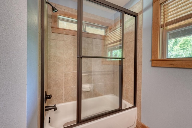 602 Mill Ridge Rd, Hiawassee, GA 30546 - bathroom with a textured wall and shower / bath combination with glass door