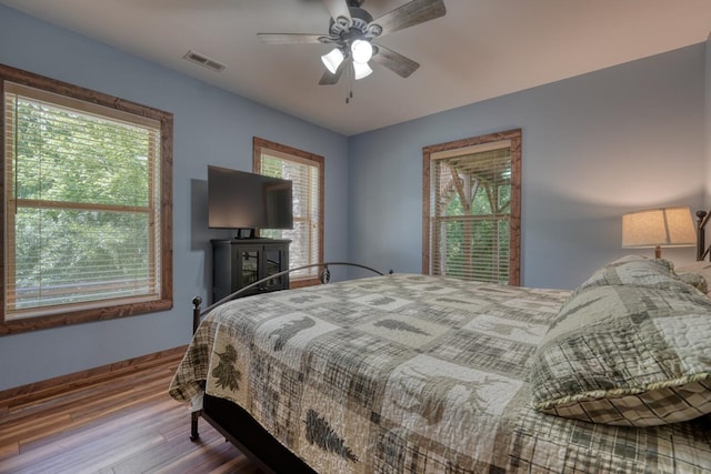 602 Mill Ridge Rd, Hiawassee, GA 30546 - bedroom featuring wood finished floors, baseboards, and ceiling fan