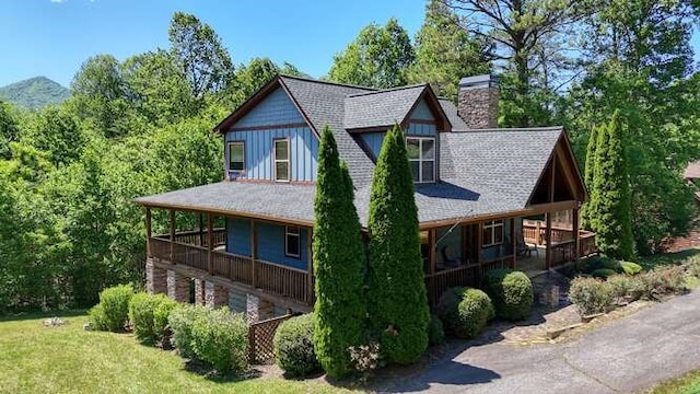 602 Mill Ridge Rd, Hiawassee, GA 30546 - view of front of property featuring a chimney, covered porch, and a shingled roof