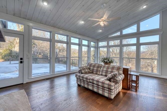 sunroom featuring vaulted ceiling, wooden ceiling, and ceiling fan