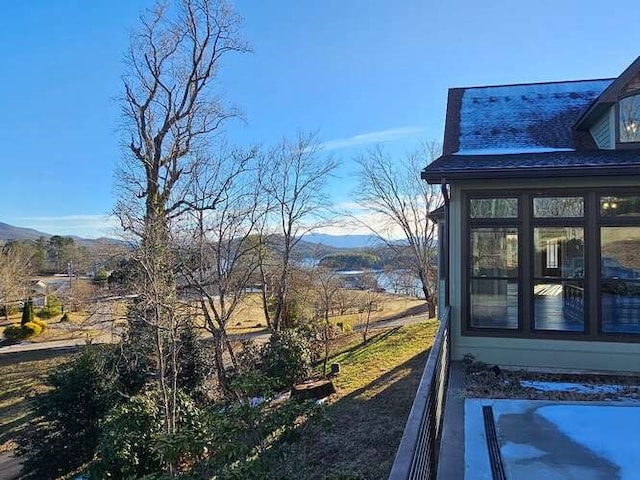 view of property exterior featuring a mountain view