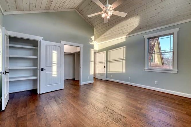 unfurnished bedroom featuring vaulted ceiling, dark wood-type flooring, ceiling fan, and wood ceiling