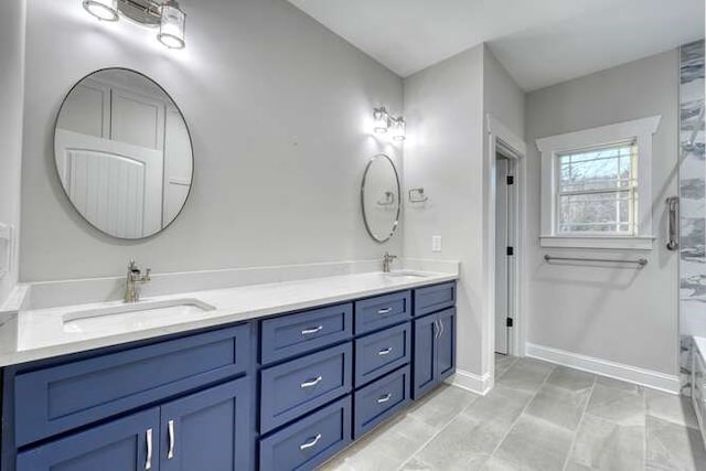 bathroom featuring vanity and a washtub