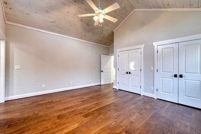 unfurnished bedroom featuring two closets, high vaulted ceiling, dark hardwood / wood-style flooring, ceiling fan, and wooden ceiling