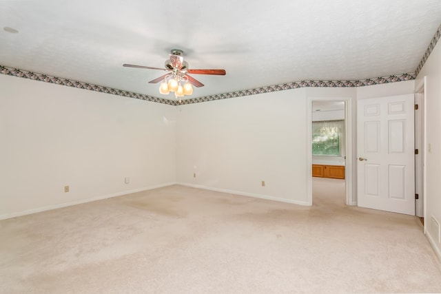 unfurnished room with a textured ceiling and ceiling fan