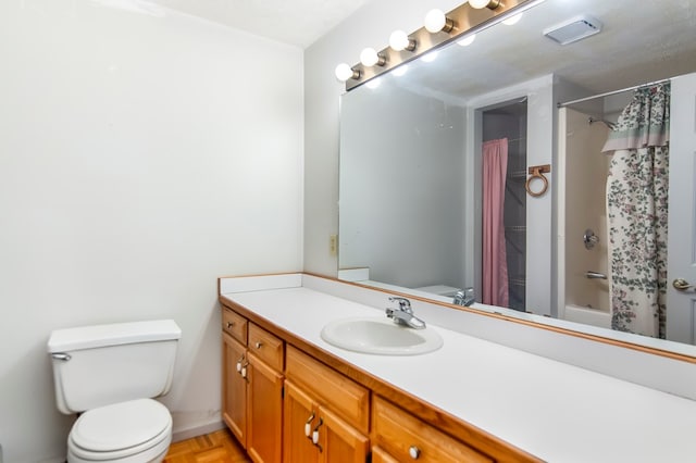 full bathroom with shower / bath combo, toilet, parquet flooring, vanity, and a textured ceiling