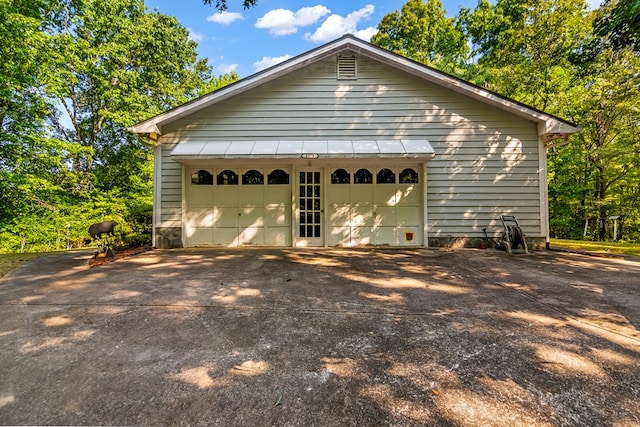 exterior space with an outdoor structure and a garage