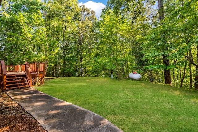 view of yard featuring a wooden deck