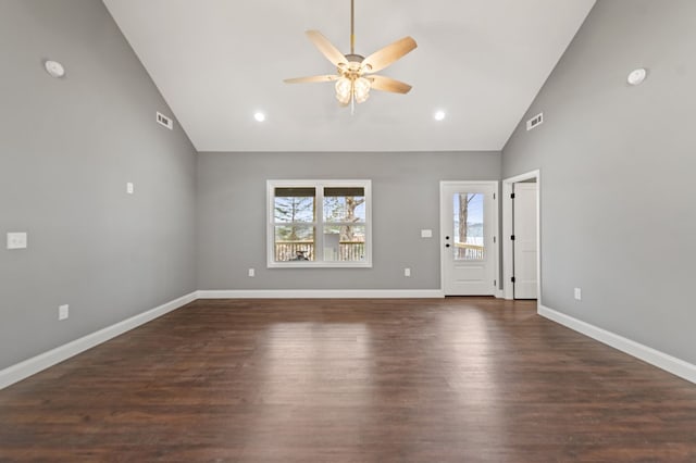 unfurnished living room featuring dark wood-type flooring, high vaulted ceiling, and ceiling fan