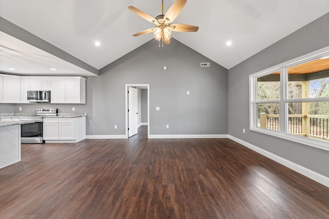 unfurnished living room featuring dark hardwood / wood-style flooring, lofted ceiling, and ceiling fan